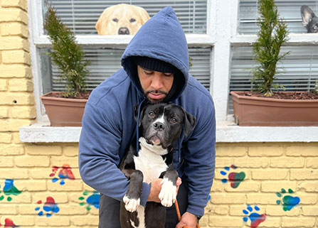 Photo of a man and a dog. Link to Gifts of Life Insurance.