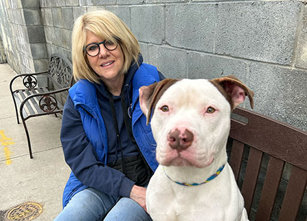 Photo of a woman and a dog. Link to What to Give.