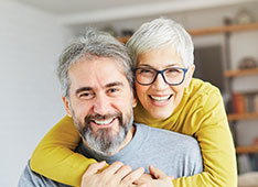 Photo of a couple smiling. Link to Life Stage Gift Planner Under Age 60 Situations.